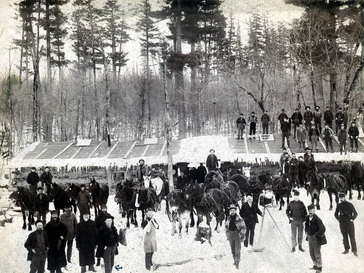 Loggers and living quarters at Hunicker Logging Camp. Near Elk River, Idaho.