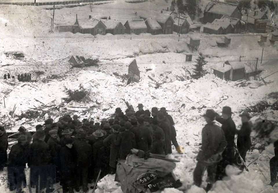 Group of people gathered at Hercules Mine after snowslide. Burke, Idaho.