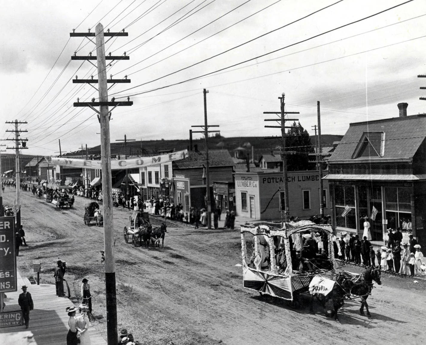 4th of July parade on Main Street. Looking southwest from the corner of 6th and Main Streets. Moscow, Idaho.